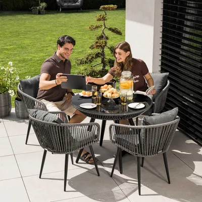 Produktbild von di volio Gartenmöbel Set RIETI - Grau, Sitzgruppe outdoor aus Polyrattan, Essgruppe mit 4 Stühlen und rundem Glastisch, wetterfest