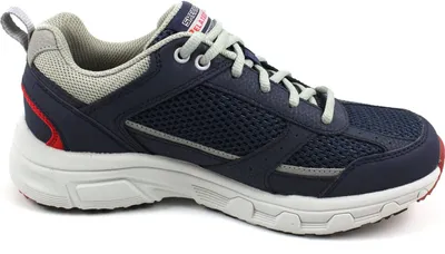 A side view of a single navy blue athletic shoe with gray laces and accents.