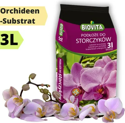 A bag of orchid substrate with orchids in the foreground.