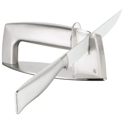 A knife sharpener with a knife being sharpened.