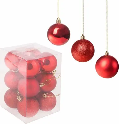 A box of red Christmas ornaments and three hanging red Christmas ornaments.