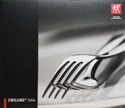 A close-up of a box for a cutlery set, featuring a partial image of forks.