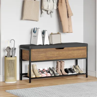 An entryway with a shoe bench, shoe rack, and coat hooks.