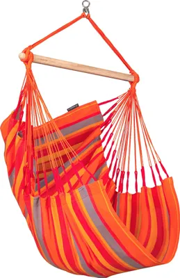 A striped hanging chair suspended from a wooden bar.