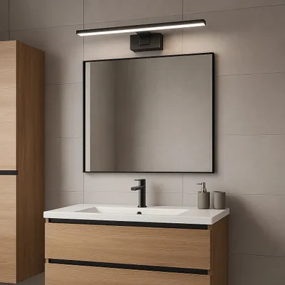 A modern bathroom vanity with a sink, faucet, mirror, and cabinet.