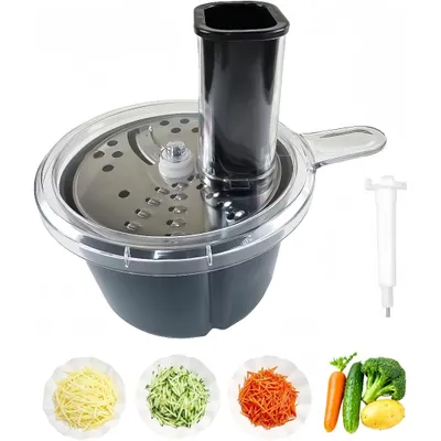 A food processor attachment with various vegetable preparations shown in small bowls below.