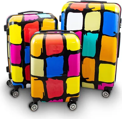 Three colorful suitcases of different sizes are arranged on a white background.