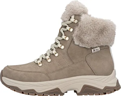 A side view of a beige winter boot with fur trim.