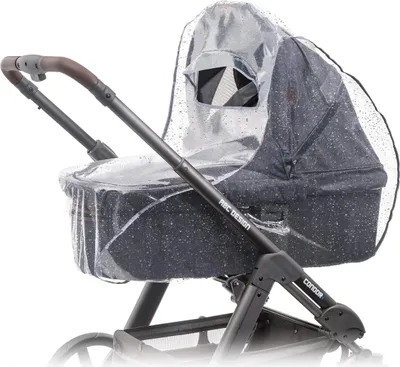 A close-up side view of a baby stroller bassinet with a clear rain cover on it.