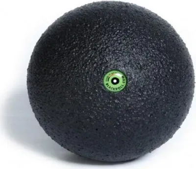 A black massage ball with a green and white logo in the center, on a white background.