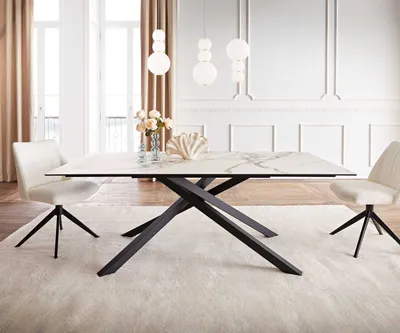 A dining room setting with a marble-topped table and chairs.