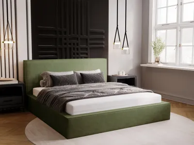 A bedroom with a green upholstered bed.
