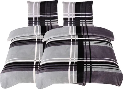 Two sets of bedding with pillowcases and duvet covers are displayed side-by-side against a white background.