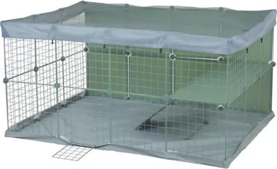 A wire cage for small animals with a fabric cover and a ramp.