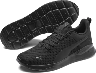 A pair of black Puma running shoes, with one shoe shown from the side and the other from the sole.