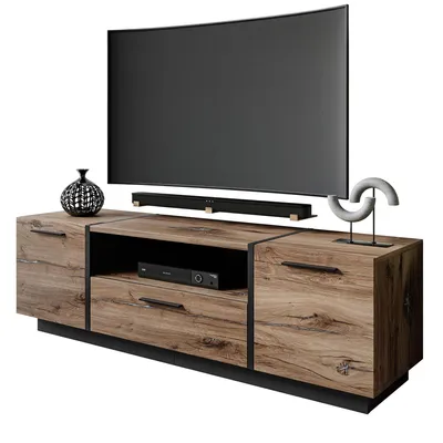A TV stand with a TV and soundbar on it, along with decorative items.