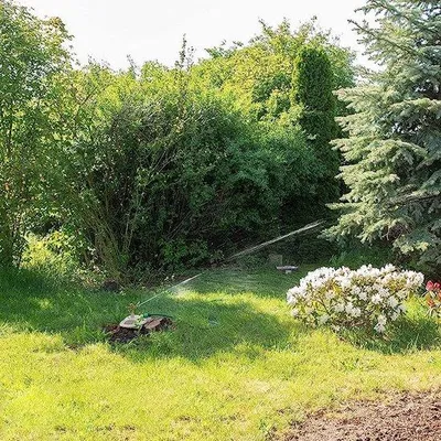 Produktbild von Famanu Gartenbewässerungssystem mit drehbarem Sprinkler - rot
