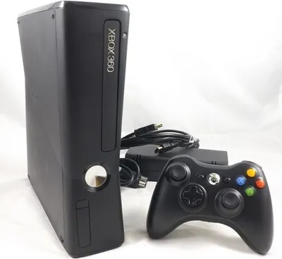 A black Microsoft Xbox 360 S console with a controller and cables on a white background.