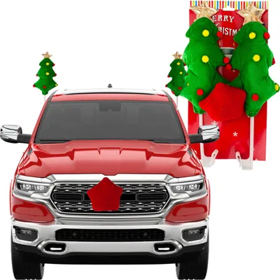A red truck decorated with Christmas-themed car accessories.
