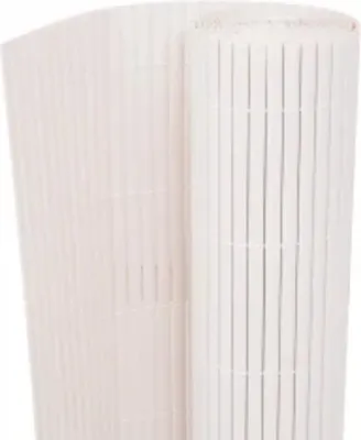A rolled-up white bamboo fence or screen.