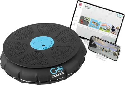A black and blue interactive balance board with a tablet and smartphone displaying games.