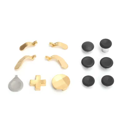 A collection of gamepad replacement parts, including joysticks and paddles, laid out on a white background.