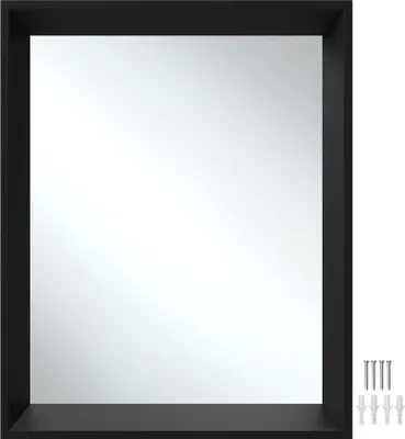 A black framed rectangular mirror with a shelf below, shown against a white background. Several screws and wall plugs are visible to the right of the mirror.