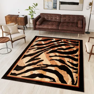 A living room scene with a brown leather sofa, a wooden cabinet, a chair, and a rug with a tiger pattern.