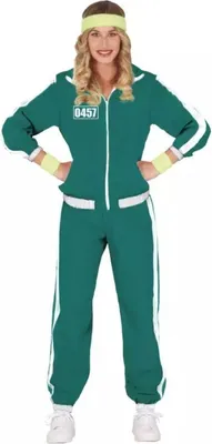 A woman wearing a green tracksuit with white stripes and a yellow headband.