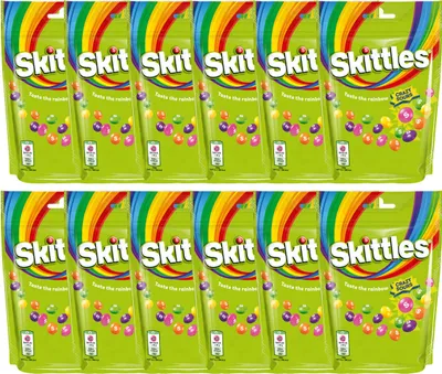 A top-down view of multiple packs of Skittles candy.