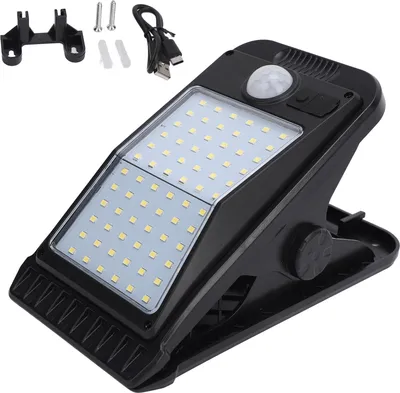 A black clip-on solar lamp with multiple LEDs and a motion sensor is shown against a white background. Accessories like a mounting bracket, screws, and a USB cable are also visible.