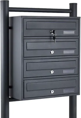 A dark gray mailbox unit with multiple compartments mounted on a stand.
