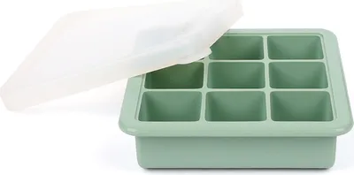 A green ice cube tray with a translucent white lid, shown from a diagonal angle.