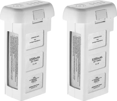 Two white drone batteries are shown side-by-side against a white background.