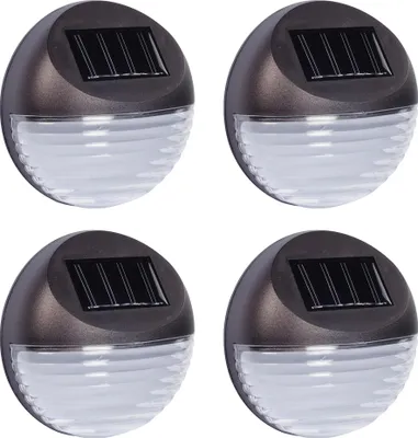Four solar-powered fence lights are arranged in a grid on a white background.