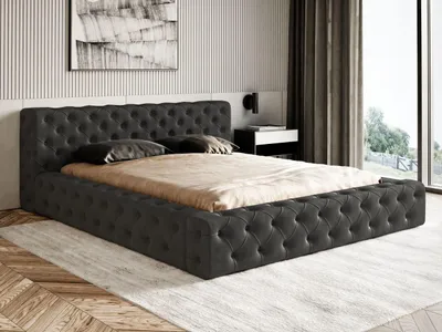 A bedroom scene featuring a tufted bed.