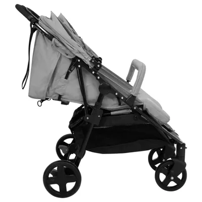 A side view of a gray stroller on a white background.