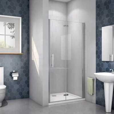 A modern bathroom with a shower enclosure, toilet, and sink.