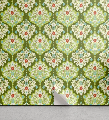 Wallpaper with a damask pattern on a wall, with a corner peeling off to reveal the floor.