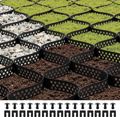 A close-up, angled view of a permeable grid system designed for landscaping, filled with gravel, soil, and grass.