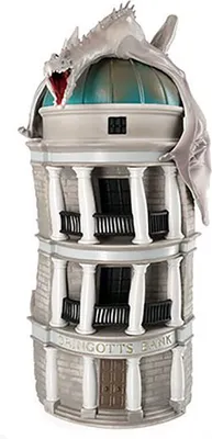 A detailed model of Gringotts Bank from Harry Potter, featuring a dragon on top.