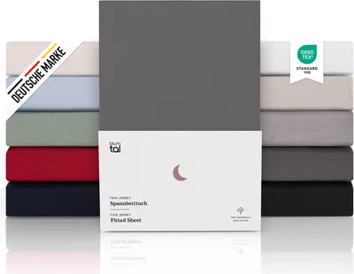 A stack of folded fitted sheets in various colors, with a close-up of one sheet and its packaging.