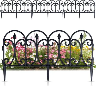 A black metal garden fence with decorative scrollwork is shown in two configurations: one above the other. The lower fence is placed in front of a blurred background of pink and yellow flowers.