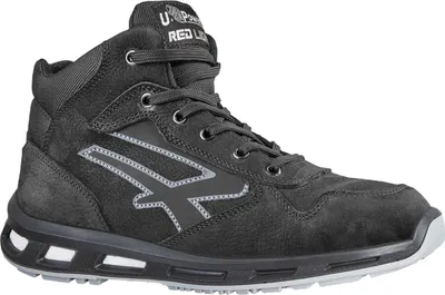 A studio shot of a black work boot.