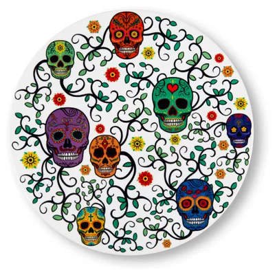 A circular ceramic coaster with a colorful Day of the Dead sugar skull design and floral elements.
