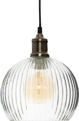 A close-up studio shot of a clear glass pendant light with a ribbed texture and a bronze-colored metal fixture.