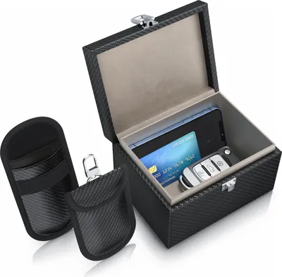 A product shot of a keyless entry signal blocking box and two key pouches, with a credit card and car key inside the box.