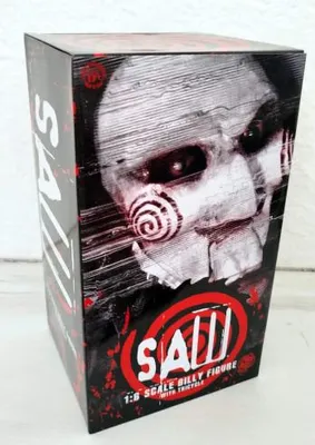 A product box for a Saw action figure, featuring the character Billy the Puppet.