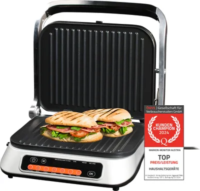A digital contact grill with two sandwiches on its lower plate, with the lid open.