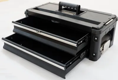 A black toolbox with two open drawers, shown from a slightly elevated side angle on a white background.